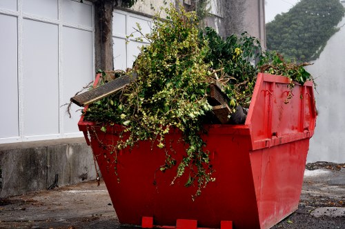 Workers wearing PPE while handling waste during clearance